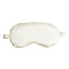 A satin sleep mask in a soft cream colour, featuring elasticated straps for comfort.