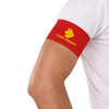 A red stretchy armband on a person's arm, featuring a logo design.