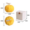 Pumpkin-shaped candles in vibrant yellow, featuring a carved face, packaged in a small white box.