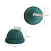 Hat-shaped candles in teal, featuring a textured knit design and a decorative white flag on top.