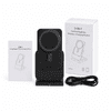 A black 3-in-1 power bank charging station with a wireless charging pad, instruction manual, and a USB cable in the box.