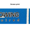 A close-up of a blue fabric featuring screen printing details in black and white. A logo is visible.