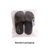A pair of black EVA slides packaged in a clear plastic bag. The slides have a textured surface and a simple design.