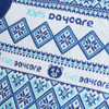 A blue and white jacquard sweater featuring geometric patterns and a logo, designed for kids.