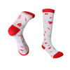 A pair of white compression socks with red accents, featuring playful patterns of hearts, band-aids, and medical symbols.
