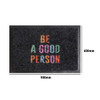 A black nylon logo mat featuring multi-coloured text. Measures 900mm by 600mm.