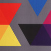A grey mat featuring a vibrant design with red, yellow, blue, pink, black, and purple triangles.