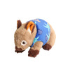 A plush wombat toy in brown with a blue patterned shirt featuring leaves and pineapples.