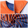A reversible jersey featuring an orange and blue striped design, showcasing the neck and sleeve details.