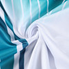 A close-up of a fabric swirl featuring white and teal stripes, showcasing a polyester material texture.