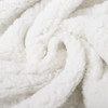 A white, fluffy blanket with a soft, textured surface, showcasing its cozy and luxurious feel.