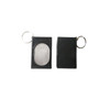 A black pet training clicker with a keychain attachment, featuring a smooth, oval button and a rectangular casing.