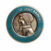 A circular hard enamel pin featuring a profile of a figure with a blue border, embossed with text and a logo.