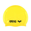A yellow swimming cap with a logo featuring black branding.