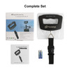 A black electronic luggage scale with a carrying strap, batteries, and a user manual, presented in a complete set.