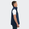 A navy vest for men featuring a high collar and a side zip, displayed on a model in profile.