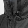 A close-up of a black women's puffer jacket featuring a zip and adjustable toggles. The fabric appears smooth and insulated.