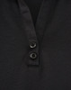 A black polo shirt featuring a textured fabric and two buttons at the neckline. It has a logo on it.
