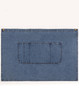 A denim half apron in blue with a front pocket and brass button accents. It has a simple, functional design.