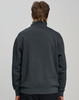 A grey 1/2 zip collar fleecy jumper with a relaxed fit, featuring a branded logo on the back.
