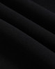 A close-up of black polar fleece fabric, showcasing its soft texture and layering. The image features a logo.