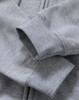 A grey men's full-zip fleecy hoodie with a close-up of the cuffs and fabric texture, featuring a logo.