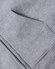 A grey full-zip fleecy hoodie featuring a front kangaroo pocket and ribbed cuffs. Includes a logo.