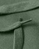 A close-up of a green hoodie featuring a knotted drawstring and textured fabric. The item has a logo.