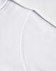 A close-up of a white fleece hoodie featuring a curved shoulder seam and a logo.
