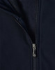 A navy softshell high-tech jacket featuring a zippered front and a fleece lining. The jacket includes a logo.
