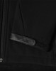 A black softshell jacket featuring a zippered front and a textured patch on the sleeve. It has a logo.