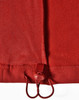 A red softshell vest featuring a drawstring adjuster at the hem and a smooth textured fabric.