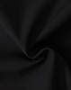 A close-up of black fabric featuring a soft texture, ideal for softshell jackets.