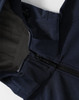 A navy men's softshell full zip hoodie with a grey lining and a zipper closure. Features a hood and logo.