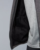 A men's grey bonded fleece jacket displaying a soft, fleece-lined interior with a pocket. It has a logo on the exterior.