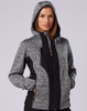 A stylish black and grey workwear jacket with a hood, featuring pockets and a fitted design. It has a logo.