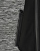 A grey and black workwear jacket featuring a zippered pocket and a textured fabric design.