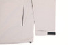 A light grey men's waterproof performance jacket featuring a zipped pocket and adjustable cuffs. The jacket includes branding.
