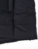 A close-up of a black seamless parka jacket, featuring a textured fabric and contrasting stitching details.