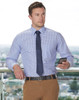 A men's long-sleeve shirt in a blue and white gingham check pattern, paired with a navy tie and beige trousers.