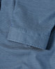A blue pin dot stretch shirt featuring a 3/4 sleeve and folded cuff detail. Includes a logo.