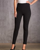 A pair of black treggings with a high waist and fitted design, accompanied by a model wearing black heels.