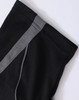 A black polo shirt featuring a grey trim along the shoulder seams and has a branding logo.