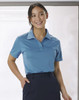 A light blue ladies' polo shirt with a collar and a logo on the chest.