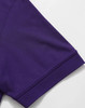 A purple polo shirt sleeve featuring a ribbed cuff and a logo. The fabric appears smooth and breathable.