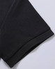 A black polo shirt sleeve featuring a textured fabric and a subtle hem. The garment has a logo on the label.