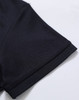 A close-up of the sleeve of a black Ladies' Truedry Pique Polo shirt, featuring a simple design and a brand logo.