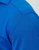 A close-up of a blue men's bamboo charcoal polo shirt, featuring a textured fabric and a collar.