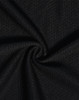 A close-up view of black textured fabric, showcasing a woven pattern suitable for polo shirts.