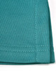 A close-up of a teal sustainable poly/cotton polo shirt showing the fabric texture and stitching details.